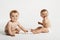 Cute Babies Sitting On White Background