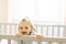 Cute baby baby on the baby room crib