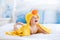 Cute baby after bath in yellow duck towel