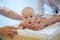 Cute baby being examined by pediatrician and looking surprised