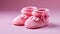 Cute baby booties in pink, a perfect gift generated by AI