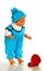 Cute baby boy doll in turquoise jumpsuit and hat with red gift box