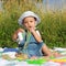 Cute baby boy eating colorful noodles