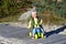 Cute baby boy playing with his colorful balance bike