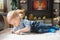 Cute baby boy playing with the remote control on a couch in the living room at home