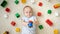 Cute baby boy playing toy car on carpet next to heap of colroful toys, blocks and bricks. Concept of children