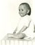 Cute baby boy sitting on table