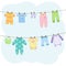 Cute baby clothes hanging on ropes