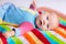 Cute baby on a colorful blanket
