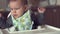 Cute baby does not want to eat her food spoon fed mother problem solids slow motion