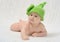 Cute baby in funny green hat