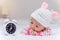 cute baby girl and alarm clock wake up in the morning