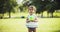 Cute baby girl exploring a park in late spring.