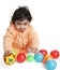 Cute Baby Girl Playing with Colorful Balls