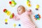 Cute baby girl playing with colorful rattle toys