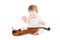 Cute baby girl playing with a violin