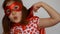 Cute baby girl plays superhero. Funny child in a red raincoat and mask playing power super hero. Superhero and power