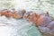 Cute Baby Hippopotamus playing into the water