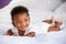 Cute Baby Lying On Tummy In Parent\'s Bed