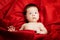 Cute baby porrait on red background