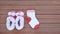 Cute baby shoes with socks on wood plank, Little shoe on wood floor with copy space, Top view