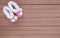 Cute baby shoes on wood plank, Little shoe on wood floor with copy space, Top view