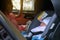 Cute baby sleeping in car seat safety drive with mother, happy family road trip travel