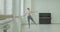 Cute ballerina practicing picce in dance studio