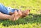 Cute barefoot children lying on grass outdoors