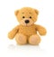Cute bear doll on white background with shadow reflection. Playful bright brown bear sitting on white underlay.