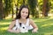 Cute beautiful laughing teen girl with white- black baby rabbit