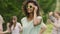 Cute biracial girl dancing with friends, young carefree students at pool party