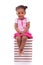 Cute black african american little girl seated in a stack of boo