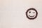 Cute blinking smiley from coffee beans, aligned middle left