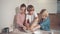 Cute blond children prepare pie dough in the kitchen. Kneading the dough.