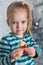 Cute blond preschool girl decorating christmas tree. Authentic family xmas time