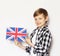 Cute blonde boy posing with british flag