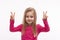 A cute blonde girl with long hair  shows victory gesture with fingers, isolated