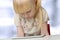 Cute blonde little girl with digital tablet