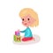 Cute blonde little girl sitting on the floor playing with block toys, kid learning through fun and play colorful cartoon