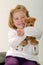 Cute blonde toddler with teddy