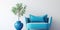 Cute blue loveseat sofa or snuggle chair and pot with branch. Interior design of modern living room with white wall