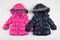 Cute blue and pink children`s winter jackets