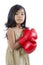 Cute boxer child wearing red boxing gloves