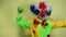 A cute boy 5-7 years old, dressed in a clown costume in a wig, smiles, plays tricks, shows tricks, laughs and conducts practical j