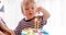 Cute boy blowing two candles on a cake. Birthday