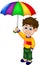 Cute boy cartoon standing under rain using umbrella with smile