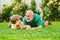 Cute boy with dad playing outdoor. Child with Grandfather dreams in summer in nature. Happy family Grandson hugs his