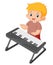 a cute boy is dancing and having fun playing the digital piano