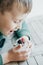 Cute Boy eating Pudding with chia seeds, yogurt and fresh fruits